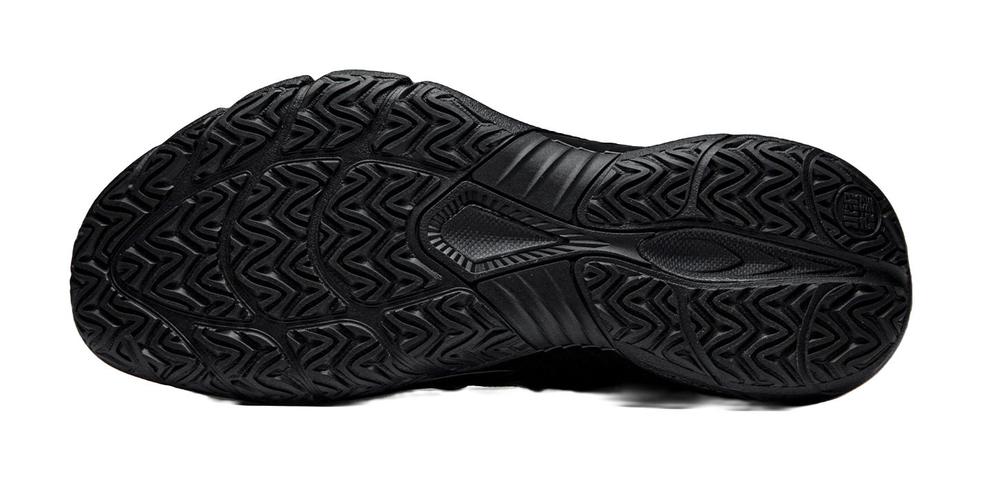 Black low-top basketball shoe outsole with textured traction tread