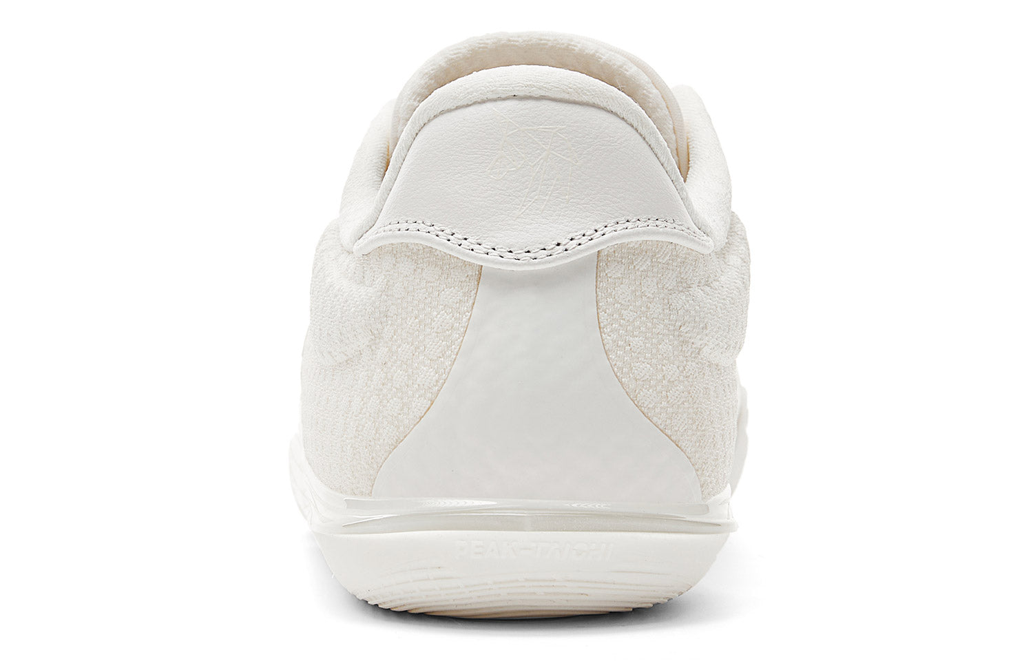 Milky white low-top basketball shoe rear view with padded heel and pull tab