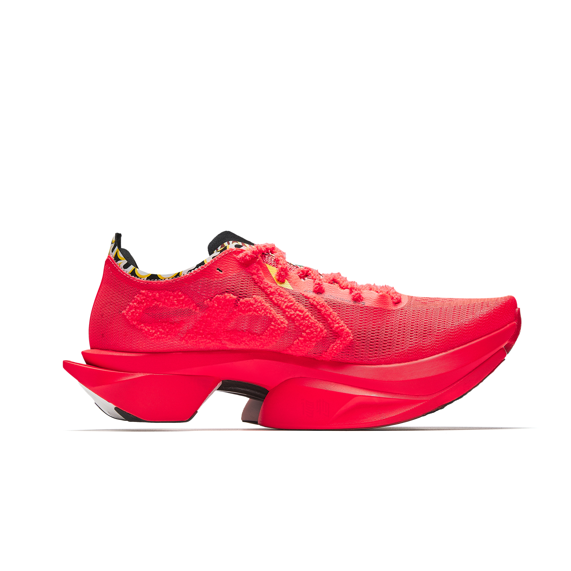Neon red running shoes side view with thick red midsole and cushioned upper