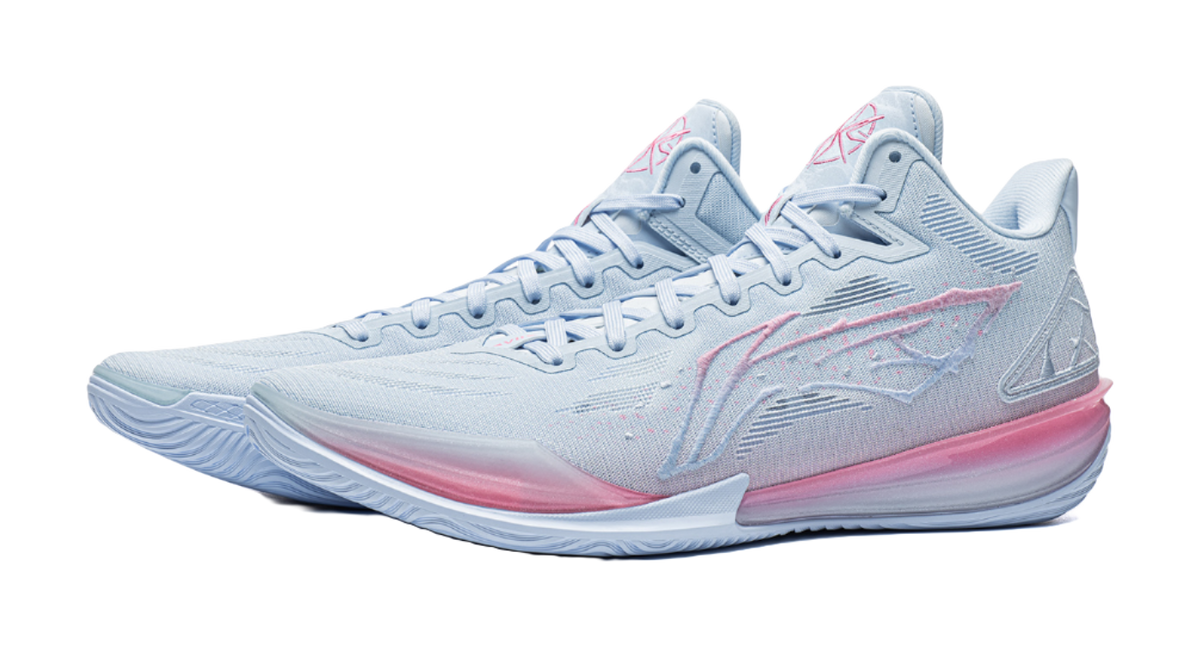 Pair of men's low-top basketball shoes, light blue with pink outsole and details