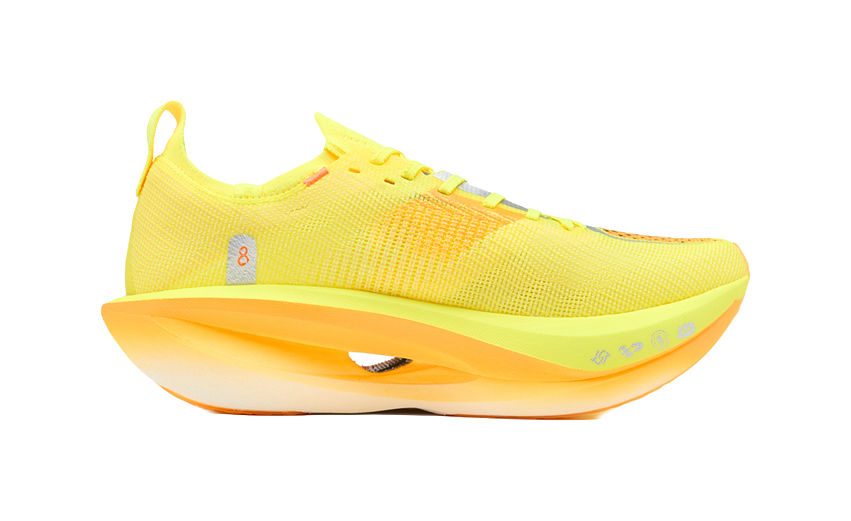 Neon yellow/black marathon racing shoe, white and orange sole, lateral side view