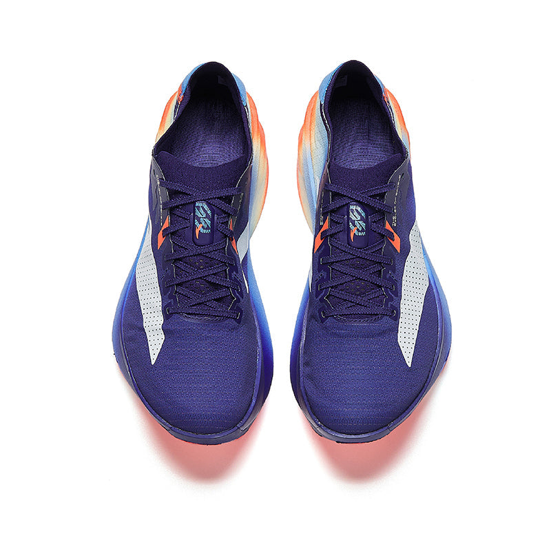 Marathon racing shoes pair, navy uppers, white side panels, orange lace accents, lace-up.