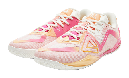 Pair of pink basketball shoes with white laces, orange highlights, low-profile sole
