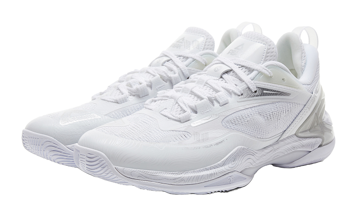 Pair of white and silver lace-up basketball shoes with breathable mesh upper and sculpted sole