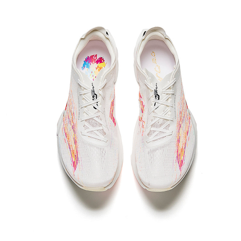 White lace-up racing sneakers with multicolor splatter on mesh upper and padded tongue
