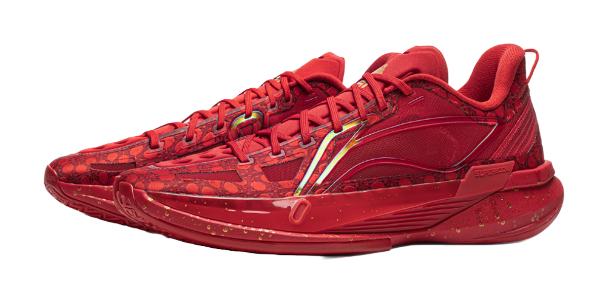 Unisex low basketball shoe, red upper with stripe trim and lace-up front