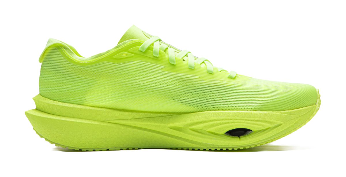 Neon yellow green low-top running shoes, side view, lace-up with thick midsole