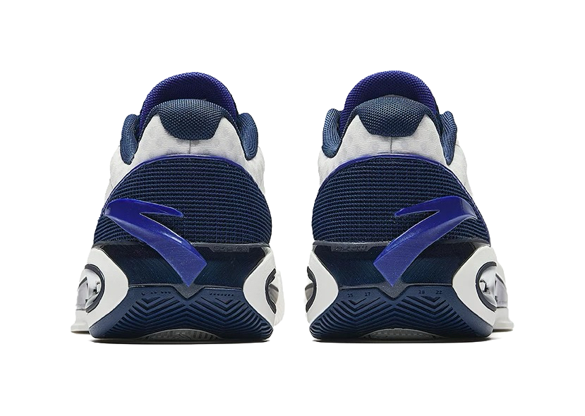 Back view unisex low basketball shoes in navy and white with heel pull tabs