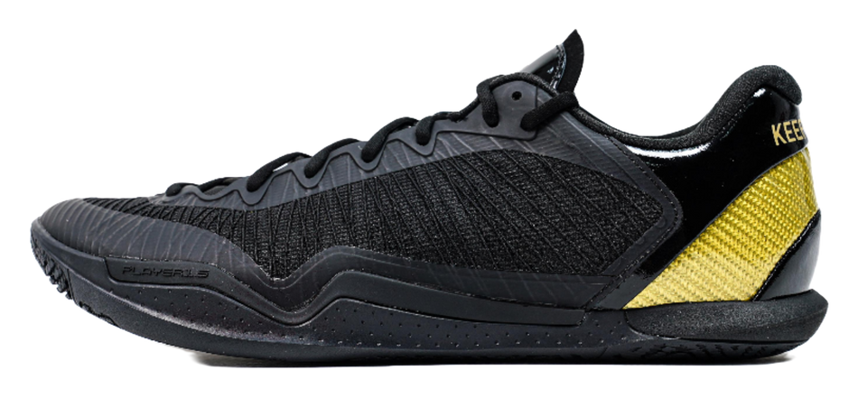 Black low-cut lace-up basketball shoe with textured upper and yellow side panel