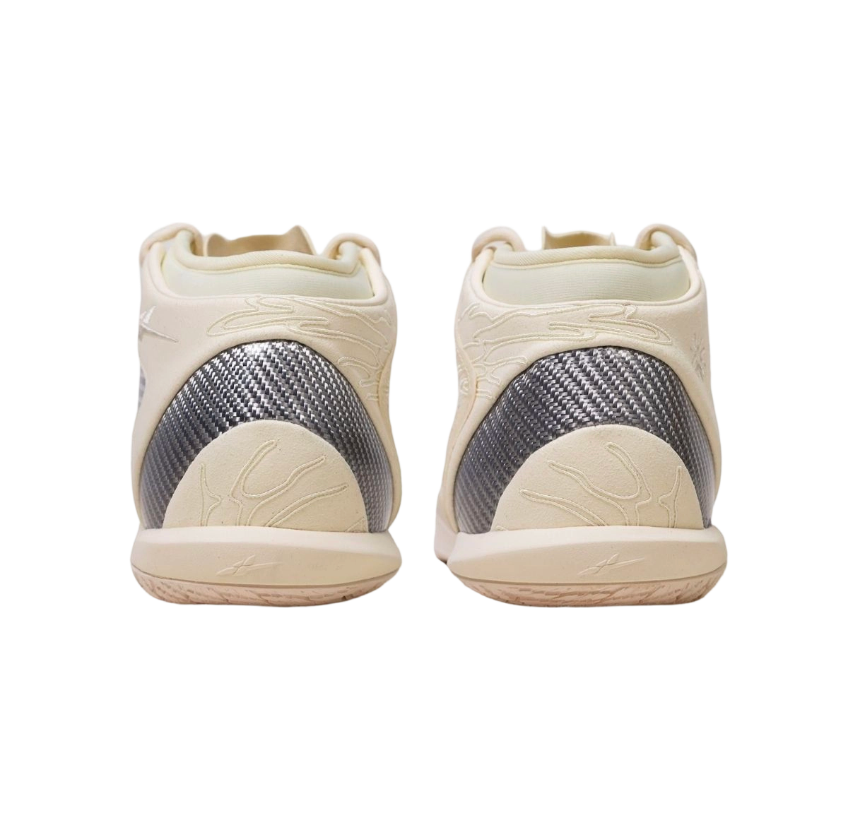 Pair of mid basketball shoes viewed from back: cream uppers with dark heel panel