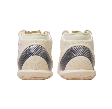 Pair of mid basketball shoes viewed from back: cream uppers with dark heel panel