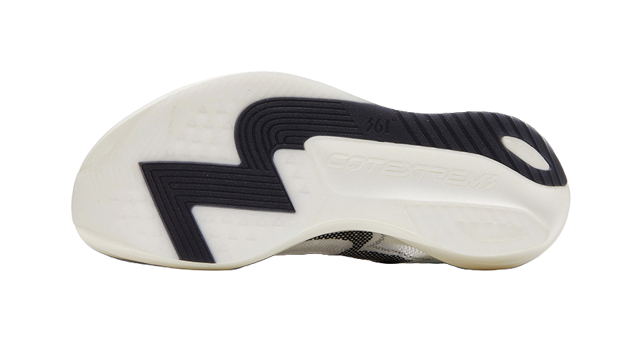 White and cream outsole with black traction pattern and dark heel insert