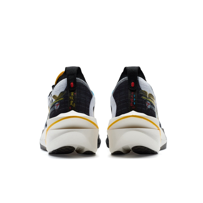 Marathon racing shoe heel view, black and white upper with yellow accent on collar