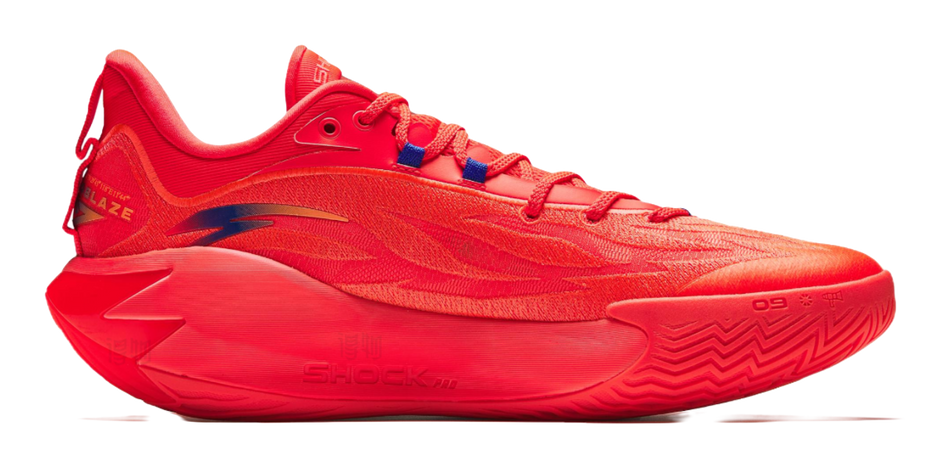 Red lace-up basketball shoe with blue accent lines and patterned midsole, side view