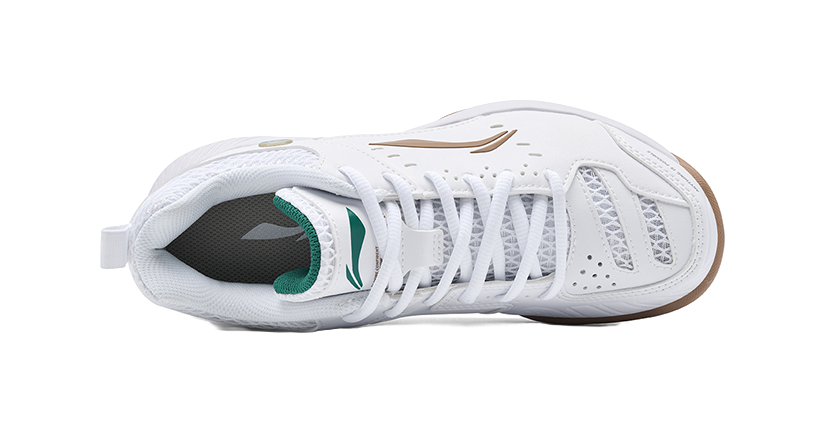 White badminton shoe with laced mesh upper and green-lined collar, tan logo.