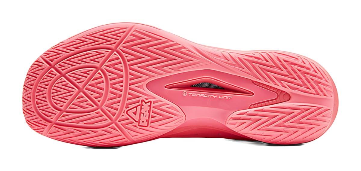 Red basketball shoe outsole with multidirectional traction pattern