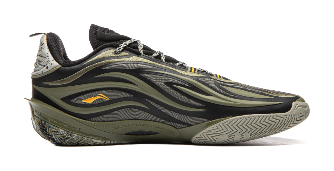 Basketball shoe angled side view in olive-green and black with orange detail