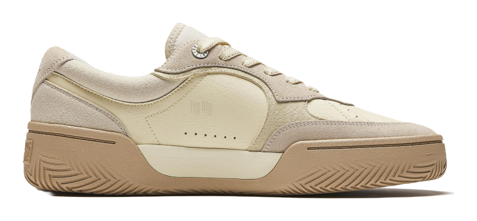 ANTA KAI Tribe unisex low-top sneaker side view in almond white and tan, laces