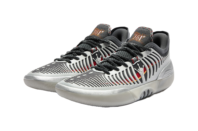 Low-top basketball shoes, silvery white with black laces and red accent stripes