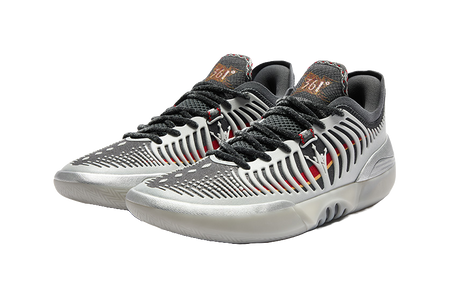 Low-top basketball shoes, silvery white with black laces and red accent stripes