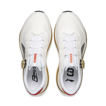 Pair of men's white running shoes, rear view, red “CHINA” tongue labels, gold trim