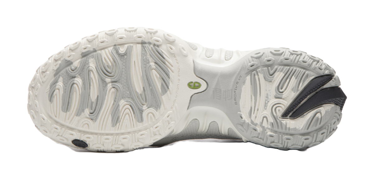 Unisex basketball shoe outsole with white tread pattern and gray/green details