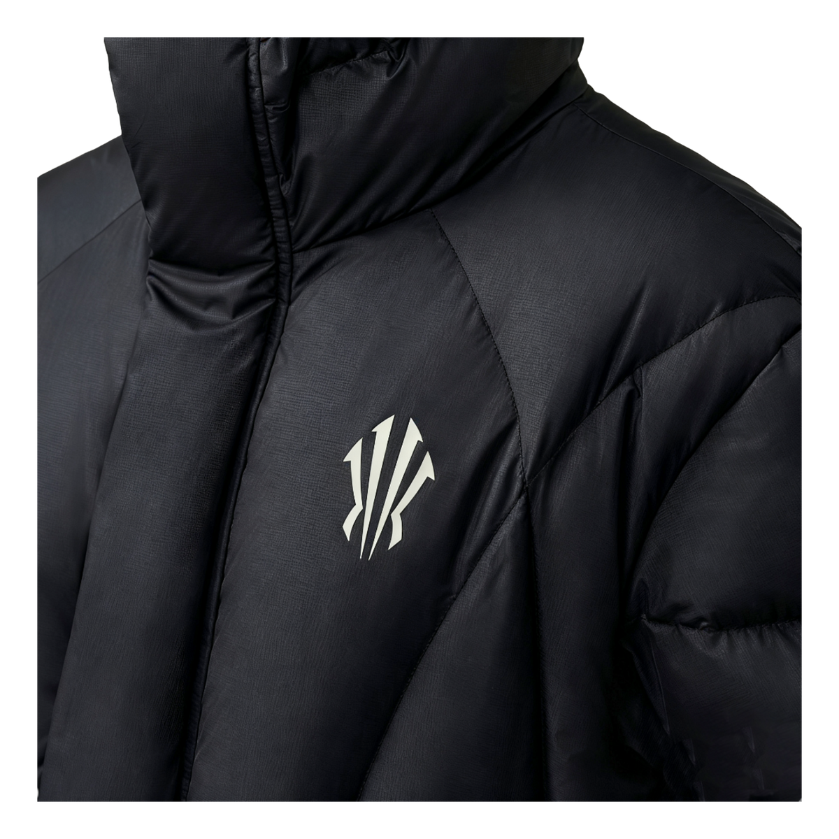Black down jacket close-up with KAI logo on quilted chest
