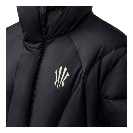 Black down jacket close-up with KAI logo on quilted chest