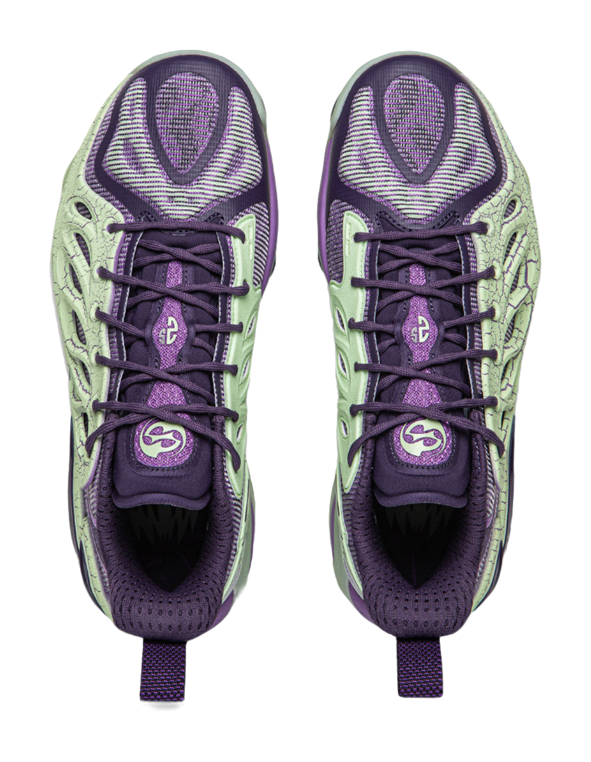 Purple and green basketball shoes top view showing laces and padded tongue