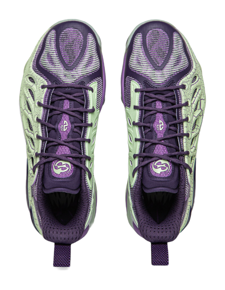 Purple and green basketball shoes top view showing laces and padded tongue