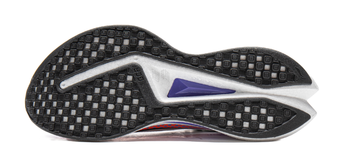 Black rubber outsole tread on white running shoe with purple heel trim