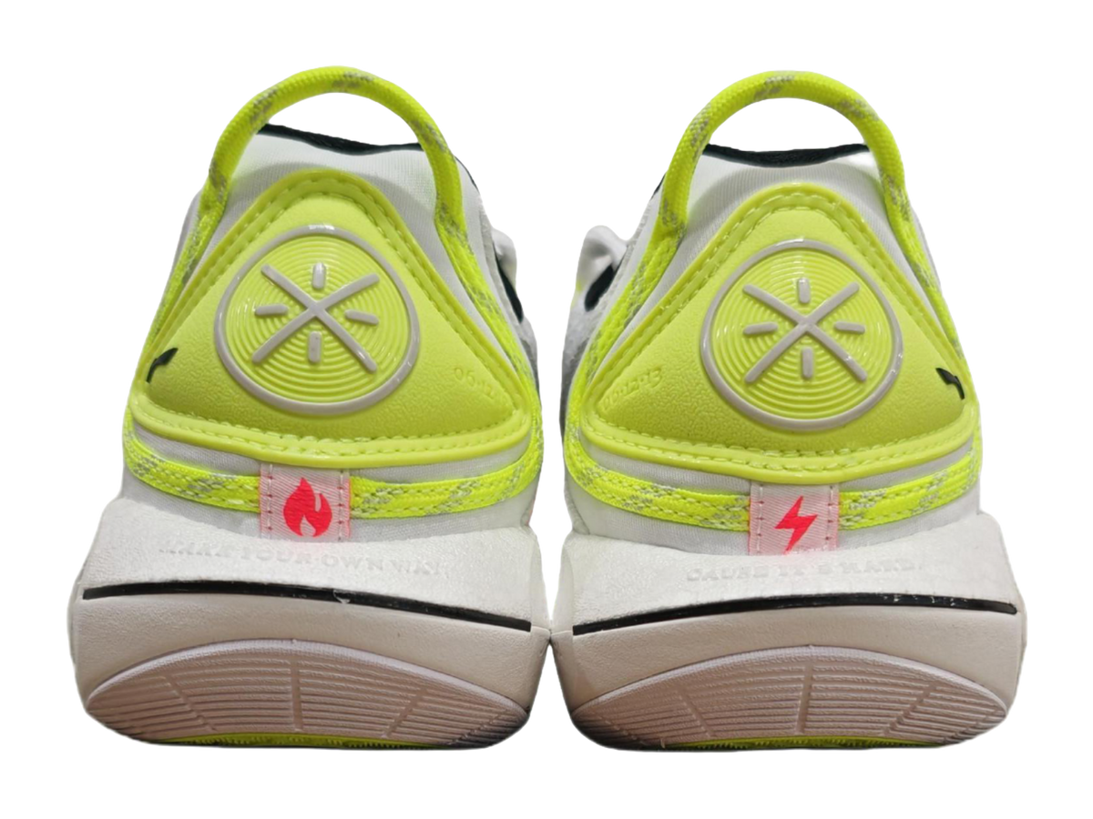 Neon green and white basketball sneaker heel with treaded outsole, rear view