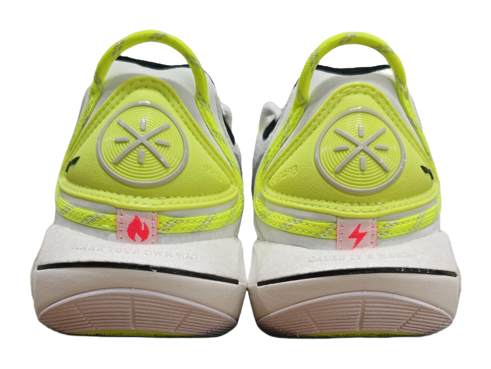 Neon green and white basketball sneaker heel with treaded outsole, rear view