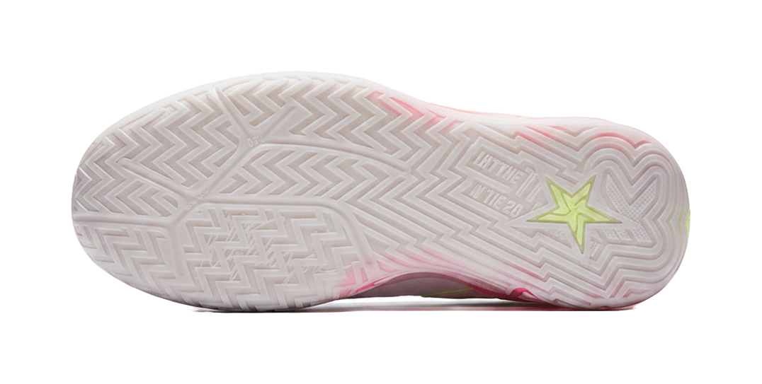 White basketball shoe outsole with zigzag tread and green star logo