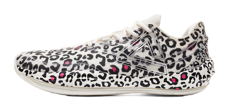 Lightweight basketball shoe in white with black leopard print and pink accents, lace-up