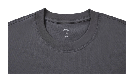 Gray crew-neck T-shirt close-up with small chest logo