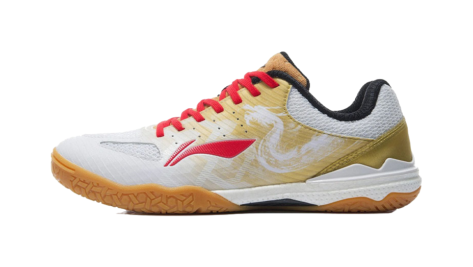 White and gold table tennis shoe with red laces, black heel collar, side view.