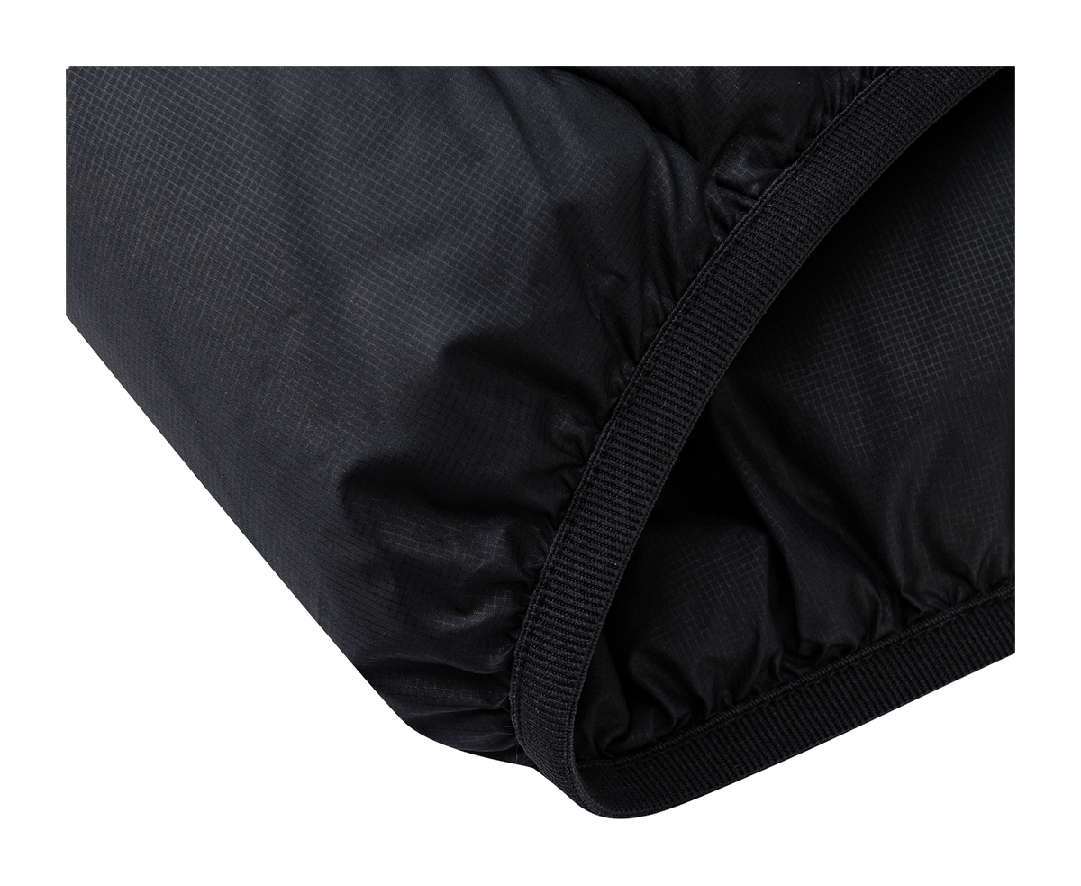 Black padded jacket hem with stitched edge and elastic trim.