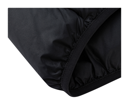 Black padded jacket hem with stitched edge and elastic trim.