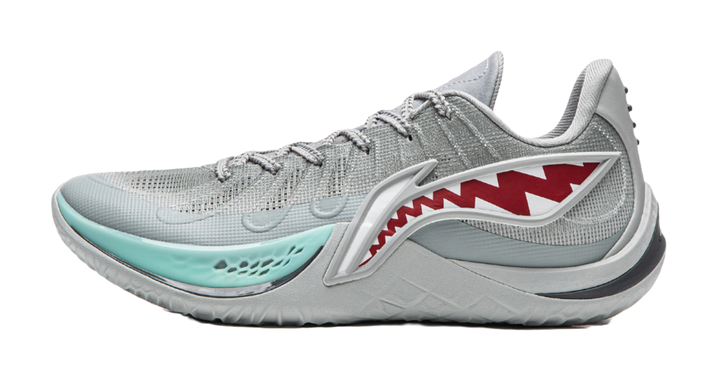 Gray basketball shoe with teal sole and red shark graphic on side