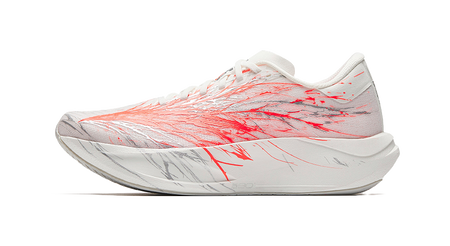 White running shoe with red patterned upper, lace-up front, light gray sole