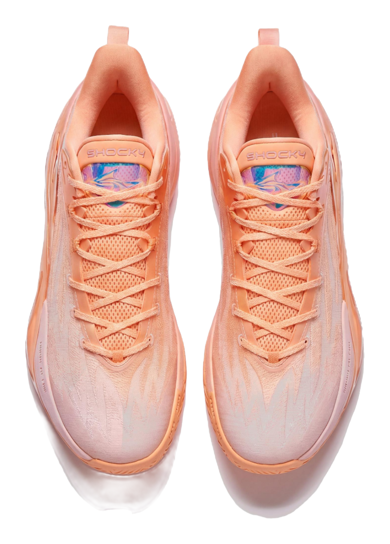 Light pink basketball shoe pair with orange laces and cushioned collar