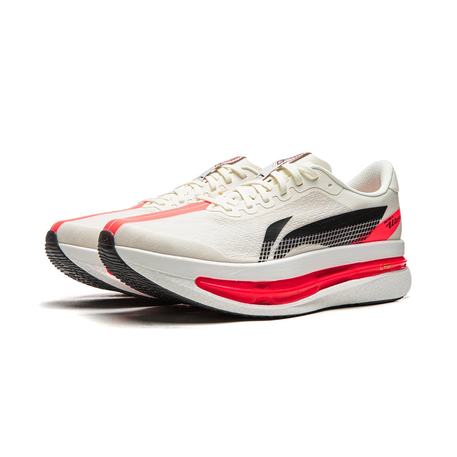 Champagne white running shoes with black logo panel and red midsole, side view