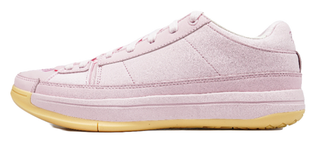 Pink low-top basketball shoes with white laces and textured gold rubber outsole