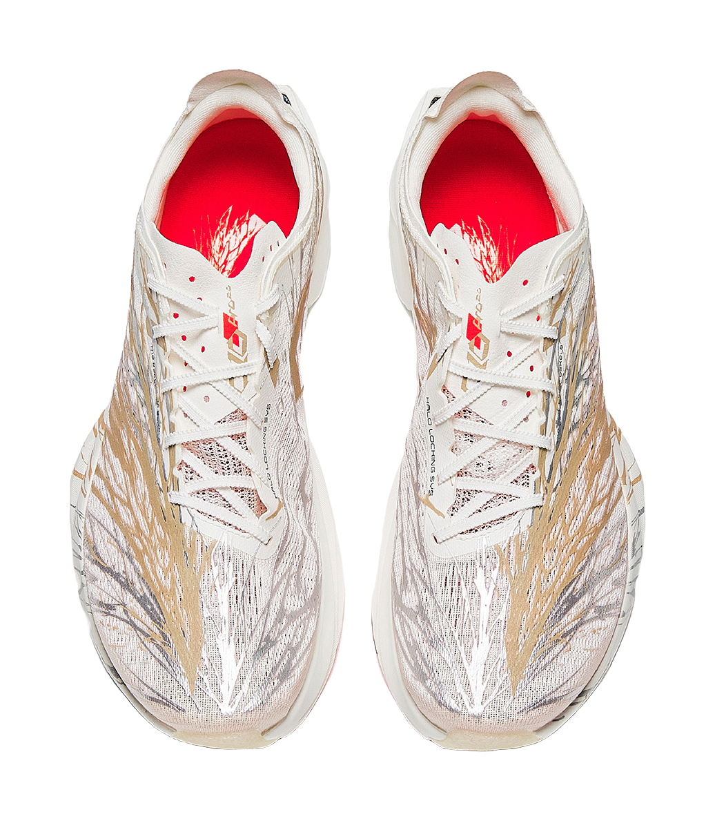 Pair of marathon racing shoes in white with bronze-gold pattern, red-lined tongue