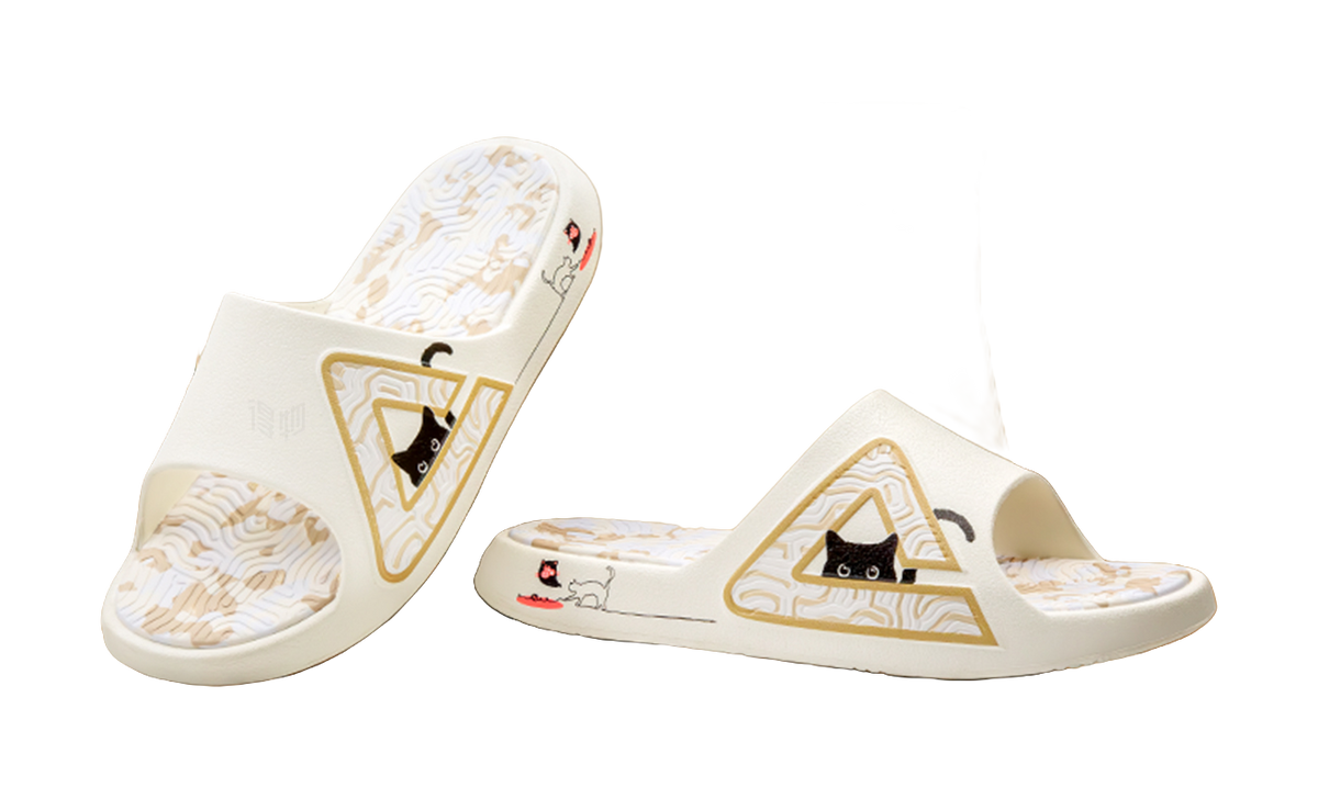 White unisex slide sandal showing triangular cat emblem on the upper