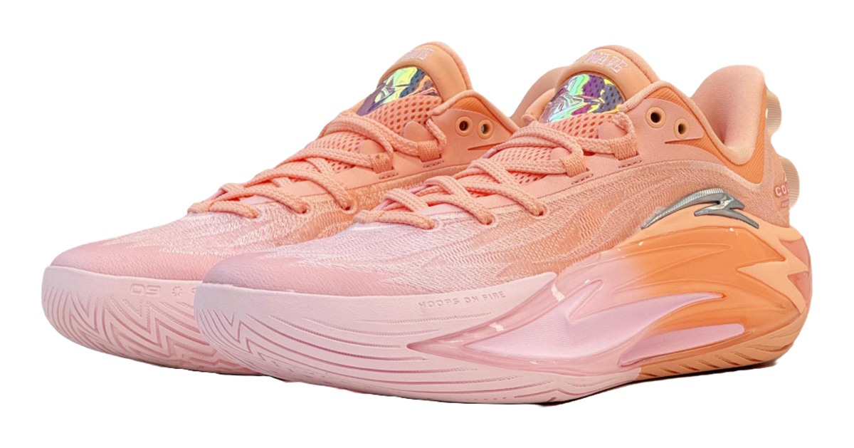 Light pink and orange basketball shoe with lace-up mesh upper and curved sole