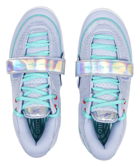 Light blue sneakers with teal lace-up front, rainbow strap, and cushioned tongue
