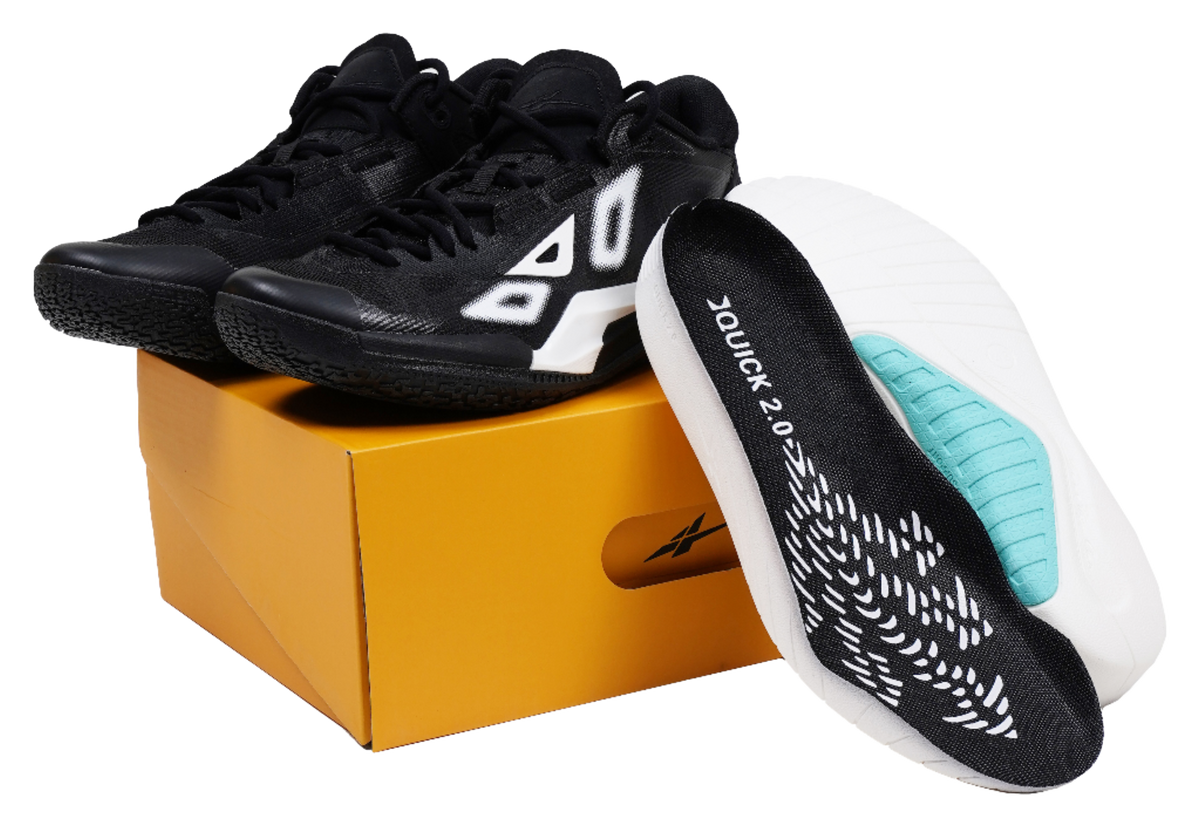 Low-top basketball shoes, black upper with white logo and blue-green insole