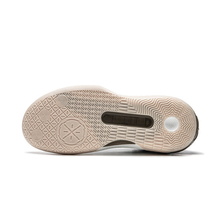 Men's basketball shoe outsole with patterned tread and beige traction sections